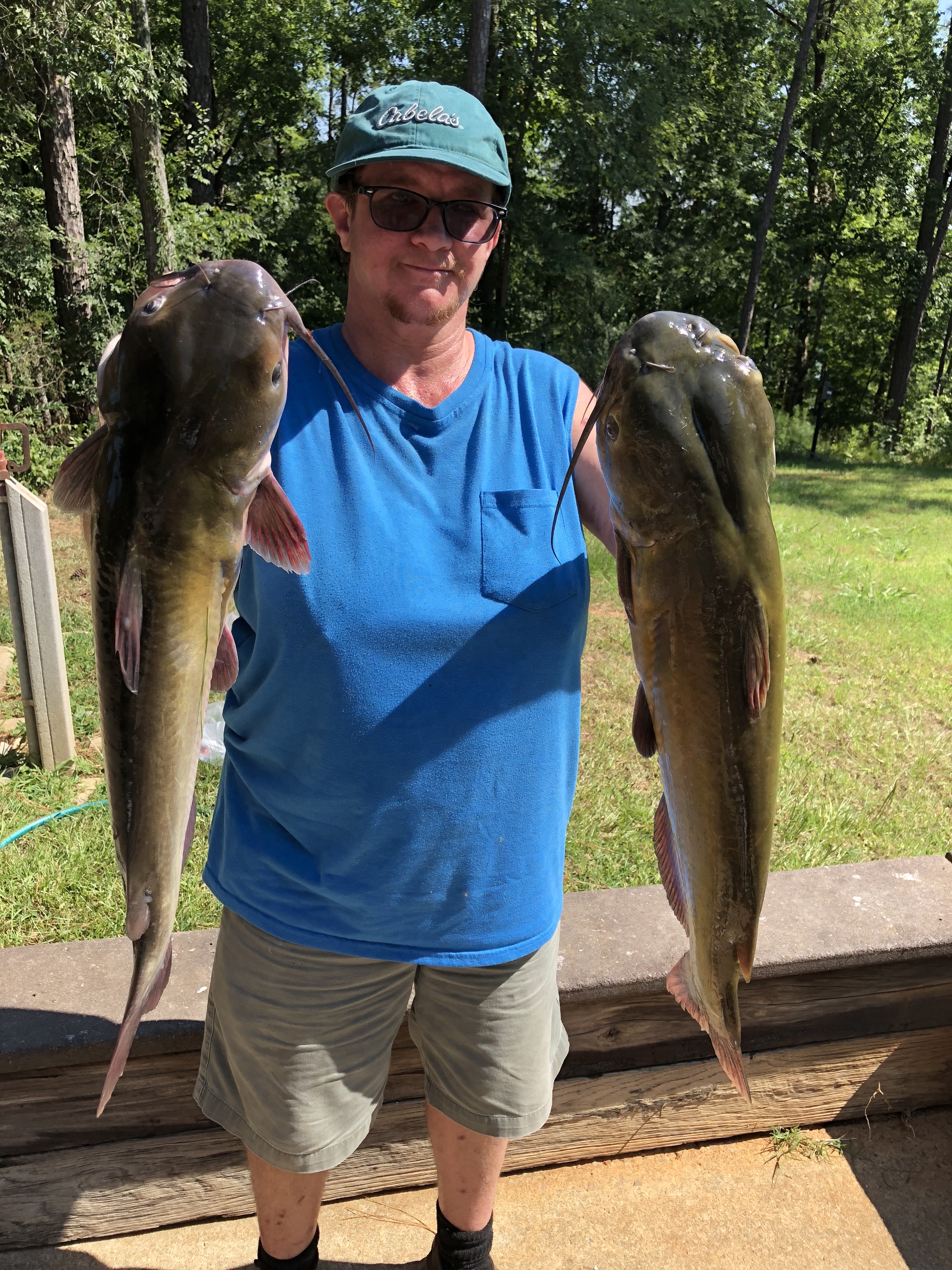 July 11, 2018 Bryan Kalsek with her two big catfish. IMG_2263