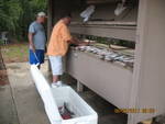Billy and Larry cleaning fish.J une 2011